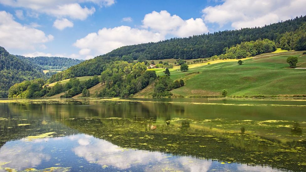 The Saugeais valley, geographically isolated by the river Doubs, has developed a unique identity (Credit: typo-graphics/Getty Images)