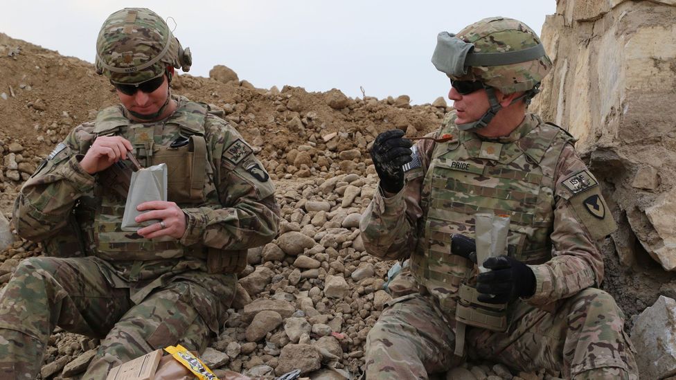 Two US soldiers tuck into their MREs (Credit: David Kamm, U.S Army CCDC Soldier Center)