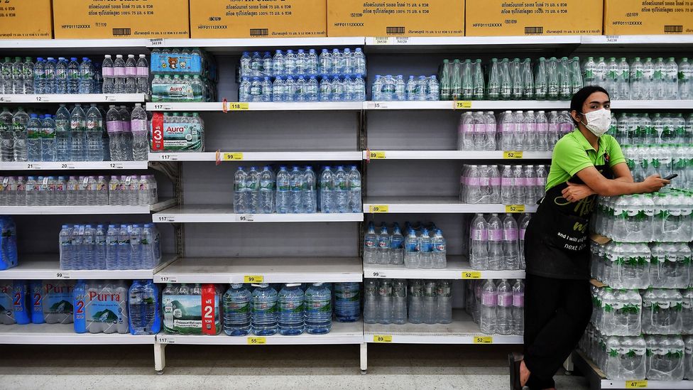 If we see people panic buying goods - like bottled water, for instance - it can force us to behave similarly (Credit: Getty Images)
