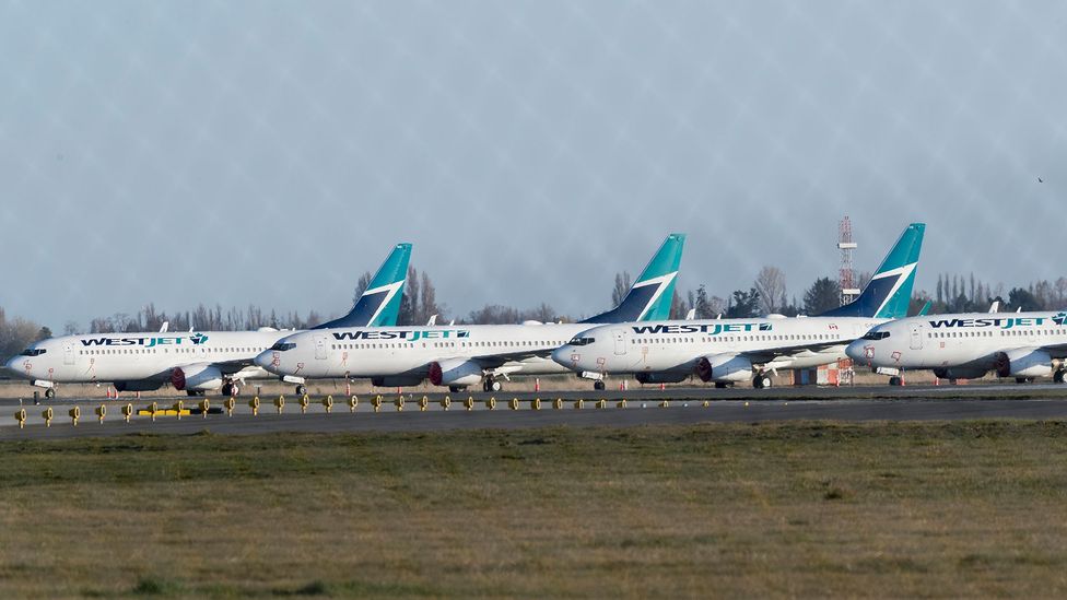 Planes, from Canada's second largest airline Westjet, sit grounded at Vancouver International Airport on April 09, 2020 in British Columbia, Canada (Credit: Getty Images) Planes, from Canada's second largest airline Westjet, sit grounded at Vancouver International Airport on April 09, 2020 in British Columbia, Canada (Credit: Getty Images)
