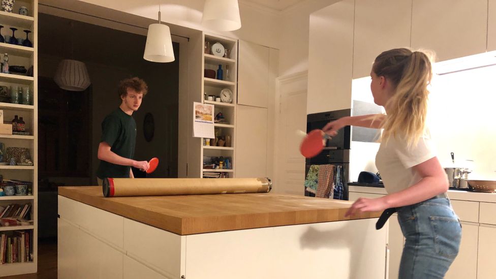 Sarah Holland's family plays ping pong on their kitchen worktop (Credit: Sarah Holland) Sarah Holland's family plays ping pong on their kitchen worktop (Credit: Sarah Holland)