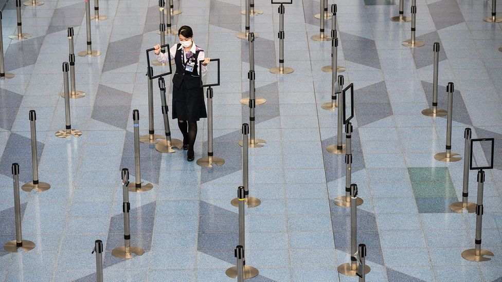 Tokyo's Haneda Airport in March as the coronavirus spread across the globe. Though much emptier, social distancing is in full effect at airports (Credit: Getty Images) Tokyo's Haneda Airport in March as the coronavirus spread across the globe. Though much emptier, social distancing is in full effect at airports (Credit: Getty Images)