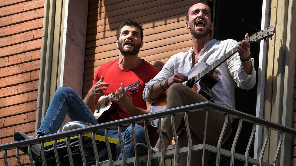 Many residents in lockdown in Italy have been playing instruments and singing on their balconies (Credit: Getty Images)
