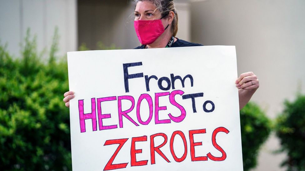 In some cases the language being used isn't appreciated: this US healthcare worker is protesting against a lack of PPE