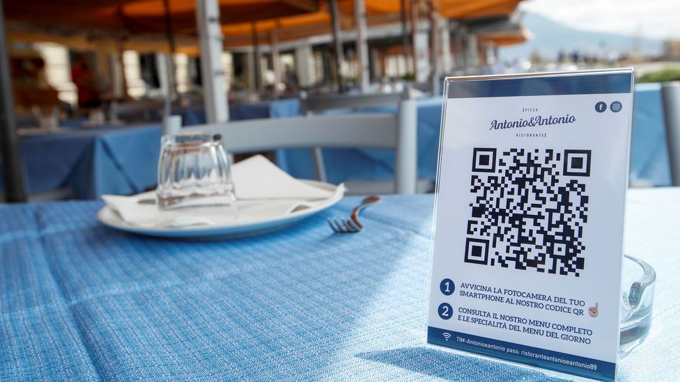 Some restaurants are turning to QR codes for touch-free ordering, as at this restaurant in Naples, Italy (Credit: Reuters)