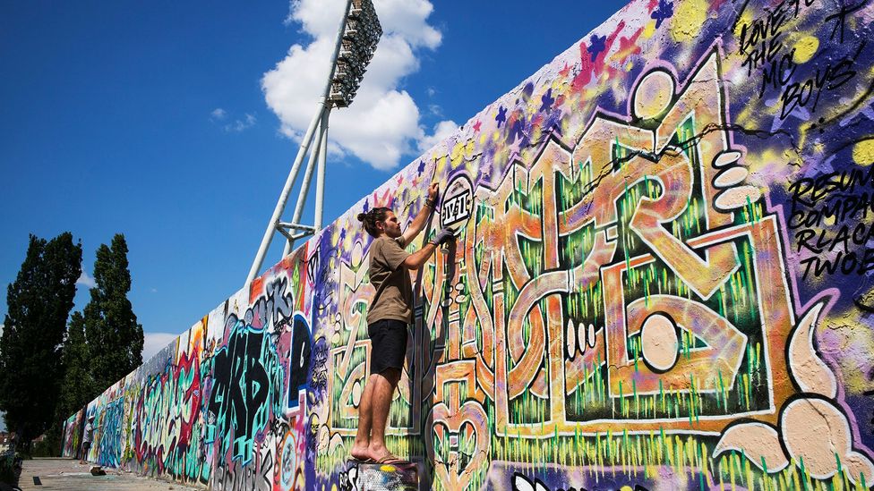 Want to grab a spray can and tag the Berlin Wall on a nice day? Sure! There's a designated space for that (Credit: Tom Stoddart/Getty Images)