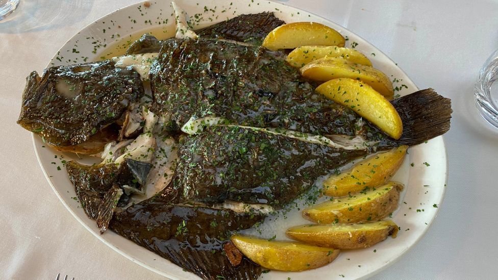 Eat grilled turbot seared over hot coals at the coastal eateries overlooking the Bay of Biscay (Credit: Ben Groundwater)