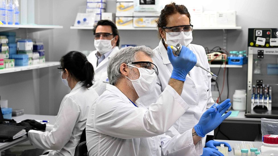 Technicians research Covid-19 at a lab in Buenos Aires, Argentina; more than 300 studies have found neurological abnormalities in Covid-19 patients (Credit: Getty Images)