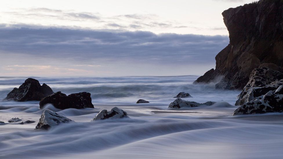 Tides are normally so predictable because of the way they are governed by the gravitational pull of the moon and the sun (Credit: Alamy)