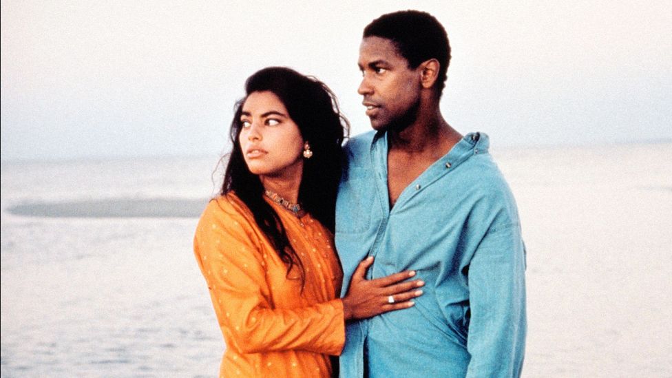 Mississippi Masala centres on a romance between a Ugandan-Indian immigrant (Sarita Choudhury) and an African-American man (Denzel Washington) in the Deep South (Credit: Alamy) Mississippi Masala centres on a romance between a Ugandan-Indian immigrant (Sarita Choudhury) and an African-American man (Denzel Washington) in the Deep South (Credit: Alamy)