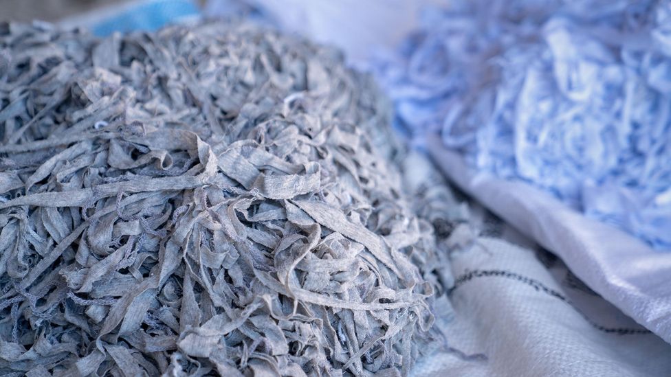 The shredding process used by mechanical recycling methods leads to shorter, weaker fibres that cannot be resued to make clothes (Credit: Alamy)