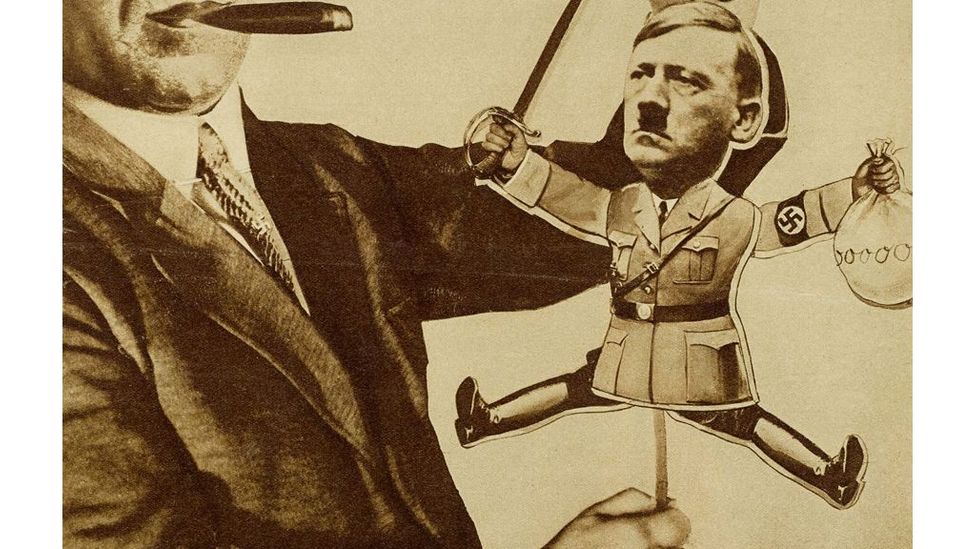In the image Tool in God's Hand? Toy in Thyssen's Hand! Hitler is the puppet of businessman Fritz Thyssen (Credit: Akademie der Kunste)
