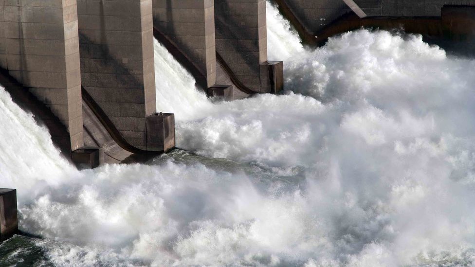 Sudden pressure changes for fish travelling past a traditional dam can kill them, even if they make it past the turbine blades (Credit: Getty Images)