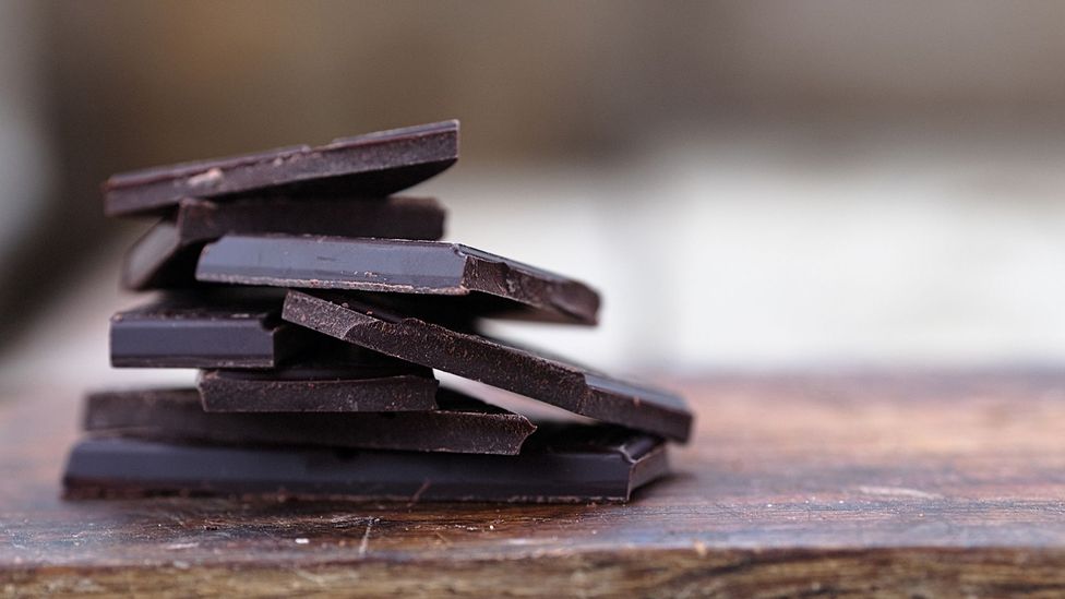 Eating a few squares of rich chocolate regularly might kill the cravings to gorge on a whole bar (Credit: Getty Images)