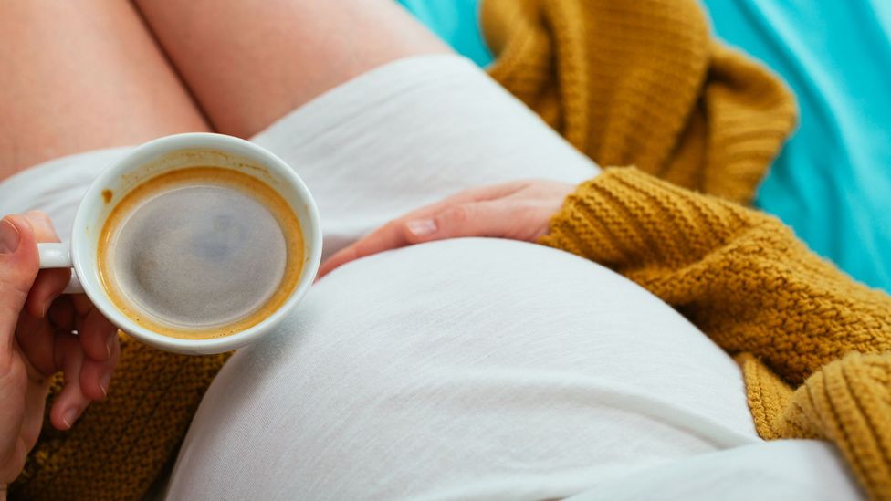 Pregnant woman with coffee (Credit: Gety Images)