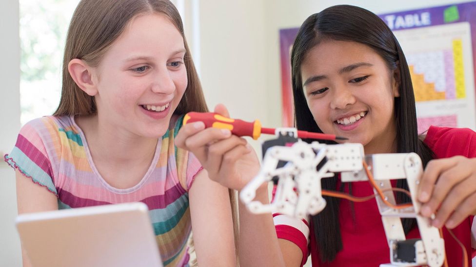 Though society is changing, girls are often conditioned to think that they shouldn't go into maths or science, which can manifest as imposter syndrome in adulthood (Credit: Alamy)