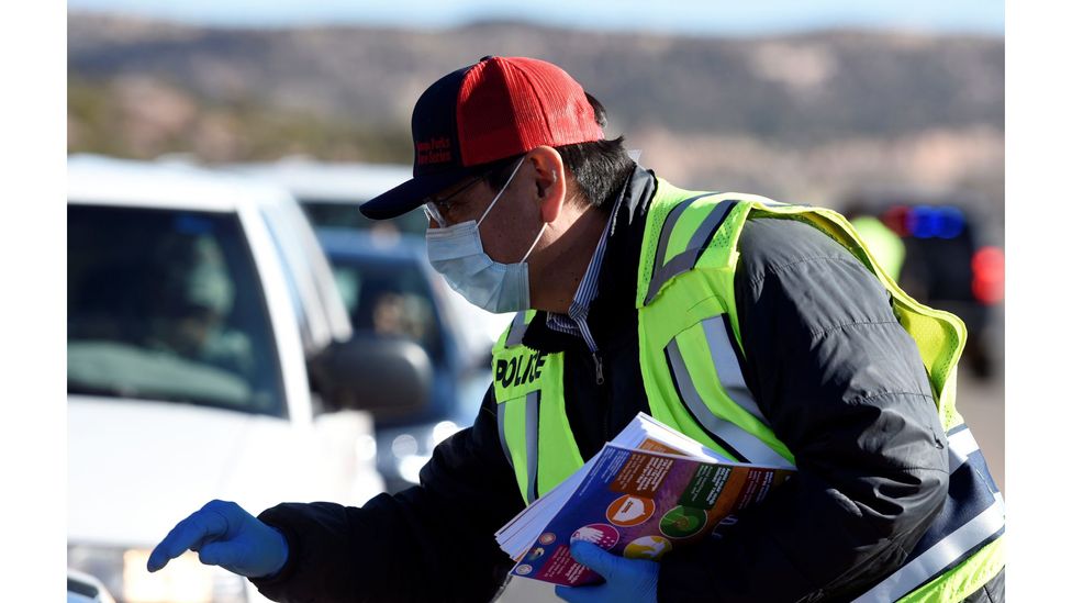 Navajo Nation President Jonathan Nez distributes educational material to drivers on how to prevent the spread of Covid-19 (Credit: Reuters)