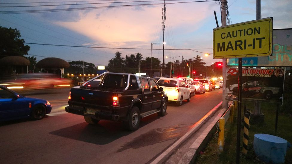 Road signs designate a stretch of road said to be "mari-it" in Iloilo, Philippines (Credit: Arnel Murga)