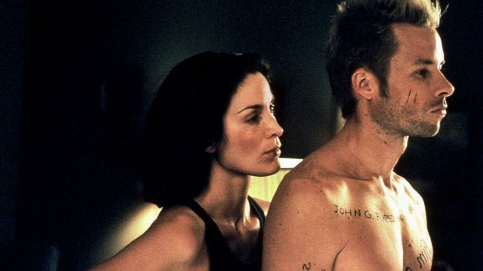 Several of Nolan's films - including Memento, which starred Guy Pearce and Carrie-Anne Moss - depend on wholly cinematic techniques (Credit: Alamy)