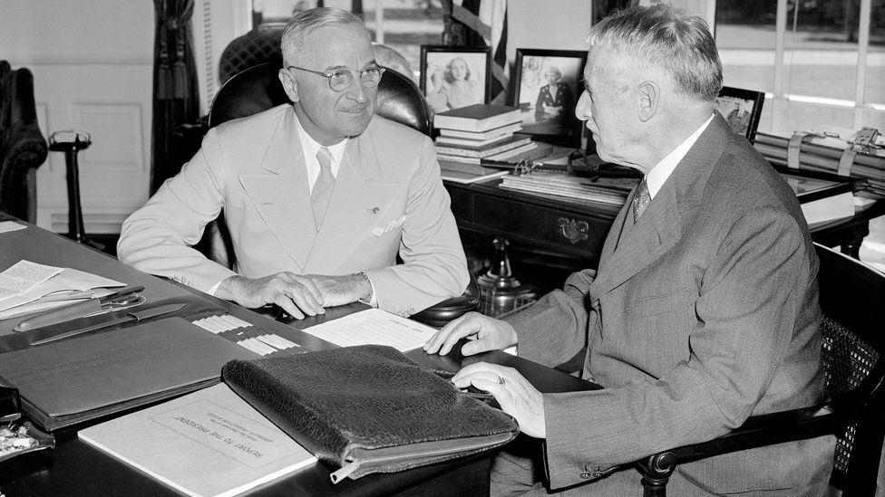 President Harry Truman (left) is briefed on the bombing by secretary of war Henry Stimson (Credit: Getty Images)