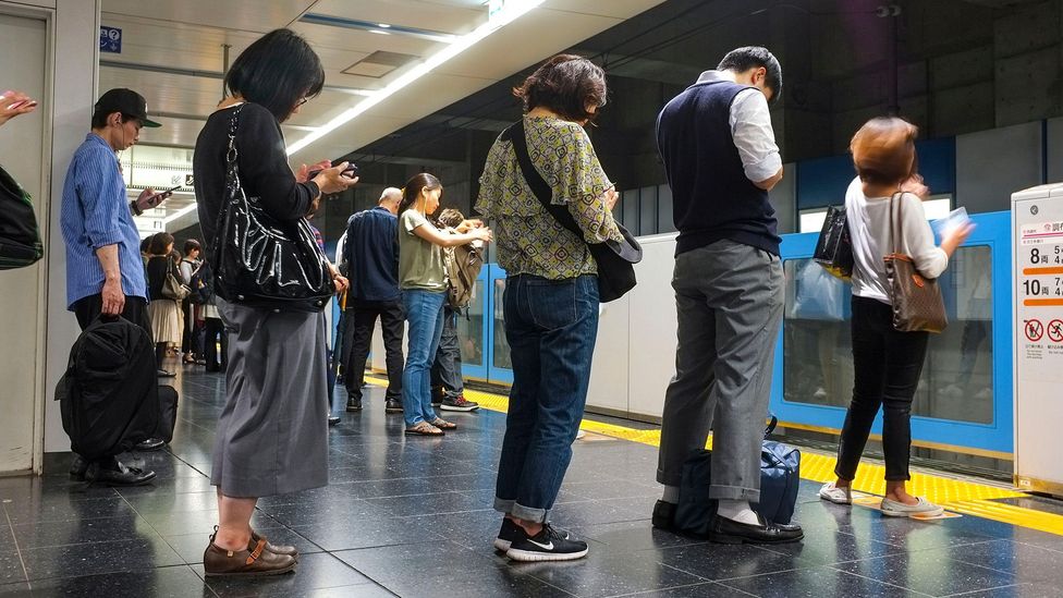 The Japanese word arukisumaho is used to describe so-called 'smartphone zombies' (credit: Alamy)