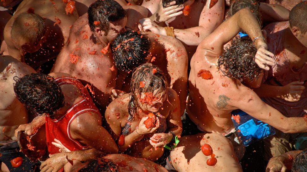 Summer festivals such as La Tomatina in Spain allow people to indugle in a few moments of unruliness (Credit: Alamy)