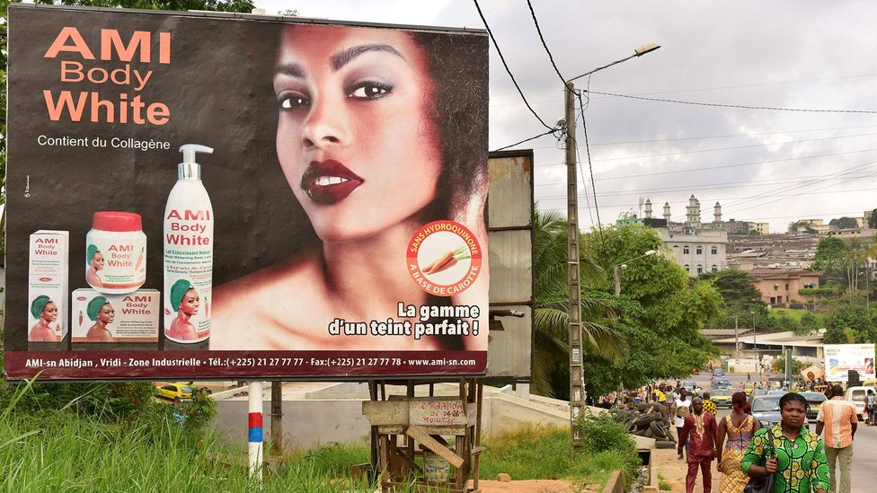 Colourism remains a phenomenon in black communities, as evidenced by this advertisement for skin-whitening products in the Ivory Coast (Credit: Getty Images)