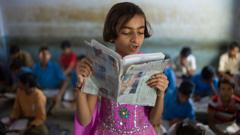 Reading aloud is often encouraged in school classrooms, but most adults tend to do most of their reading silently (Credit: Alamy)