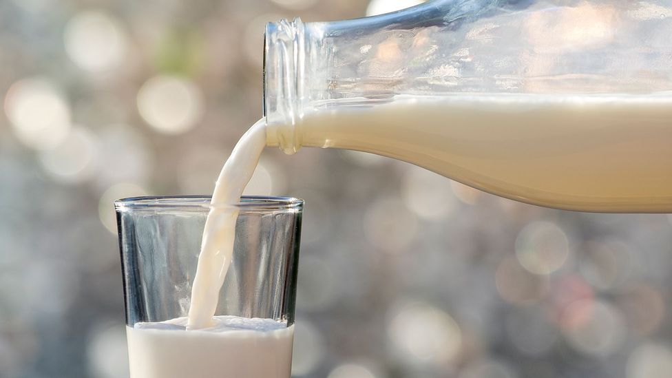Milk pouring into glass (Credit: Getty Images)