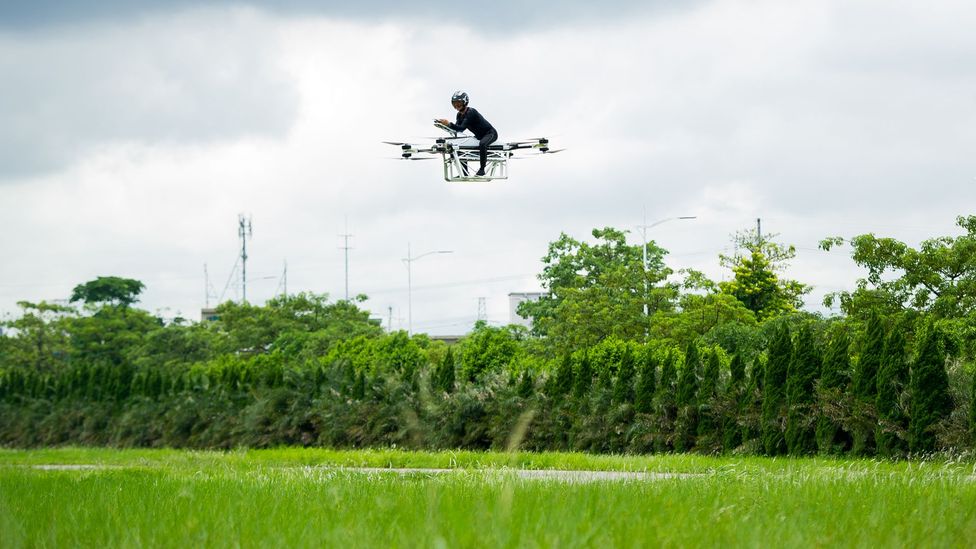 Zhao Deli rides a flying motorbike, which he built himself, during a test flight in 2019 in China (Credit: Getty Images)