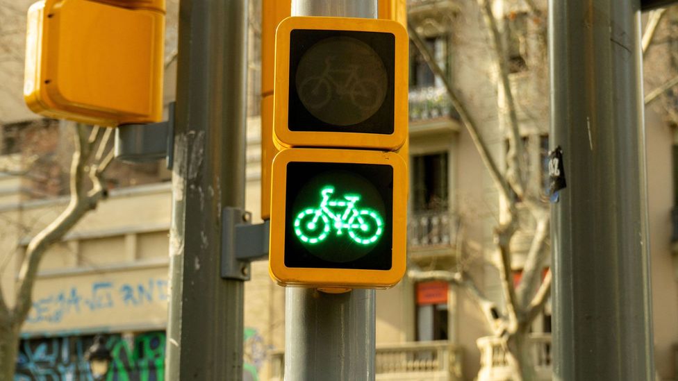 Biking has enjoyed a renaissance around the world as urbanites shun public transport for the relative safety of a two-wheeled commute (Credit: Alamy)