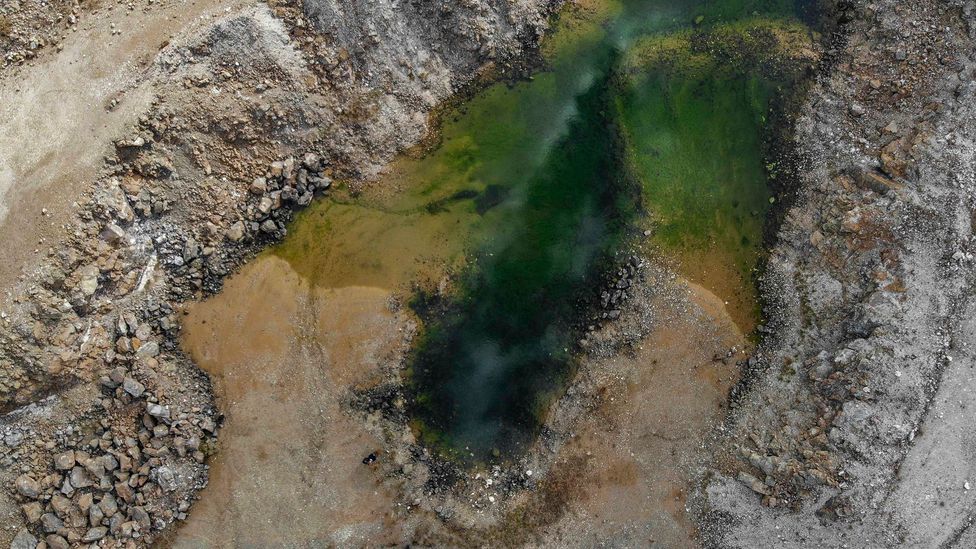 Like a jewellery pendant, a pond at an abandoned magnesite pit near Vavdos village in the mountains of Chalkidiki, Greece (Credit: Nicolas Economou/Getty Images)