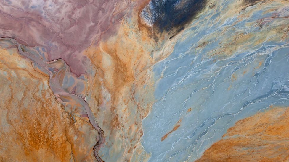 Mixed with water, the iron minerals spread like watercolour paint across the landscape (Credit: Peter Adams/Getty Images)