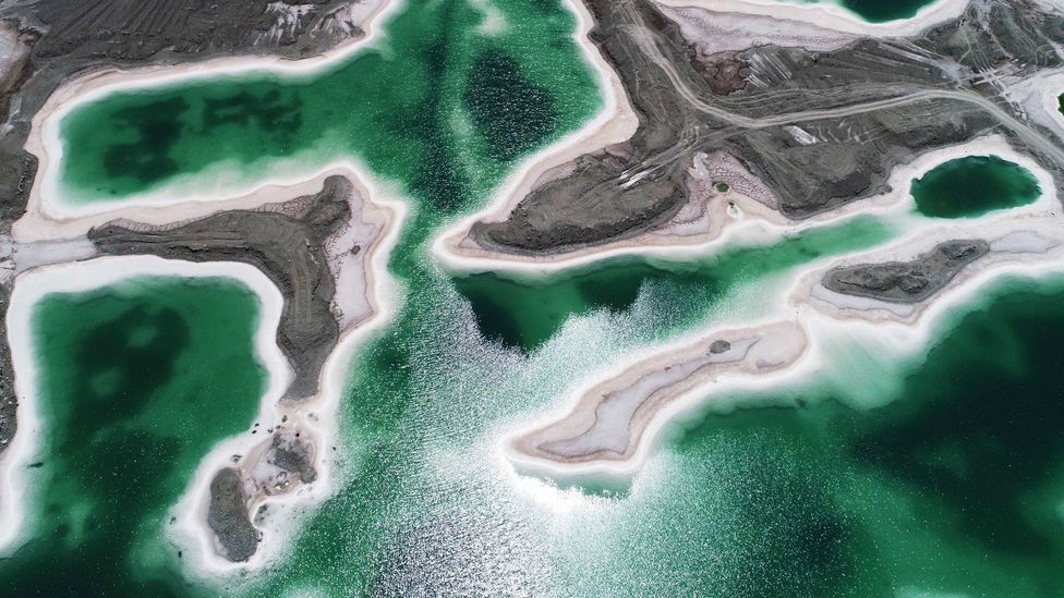 There, historic mining left behind salt and other minerals in giant ponds with a greenish hue (Credit: Getty Images)
