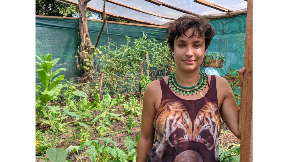 Mariel Romero Mendez, AstilleroVerde coordinator, stands by the organisation's garden, where produce such as mango, avocado, and tomatoes are grown (Credit: Jocelyn Timperley)