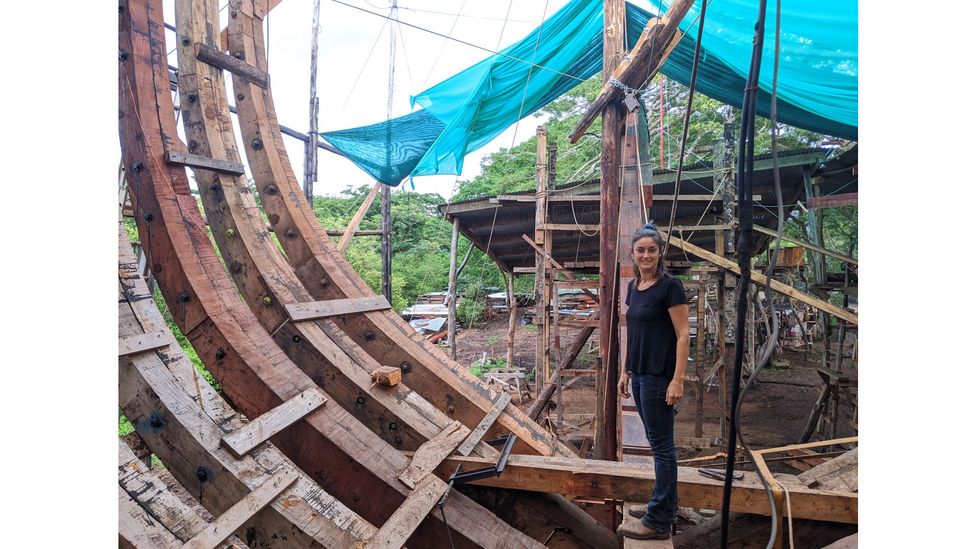 Danielle Doggett, Sail Cargo's co-founder and managing director, inspects the progress of Ceiba's construction from inside the hull (Credit: Jocelyn Timperley)