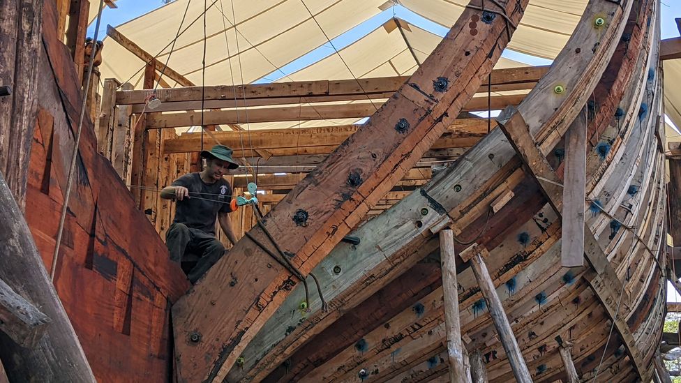 Lynx Guimond, Sail Cargo's co-founder and technical director, works to install Ceiba's first stern half frame (Credit: Jocelyn Timperley)