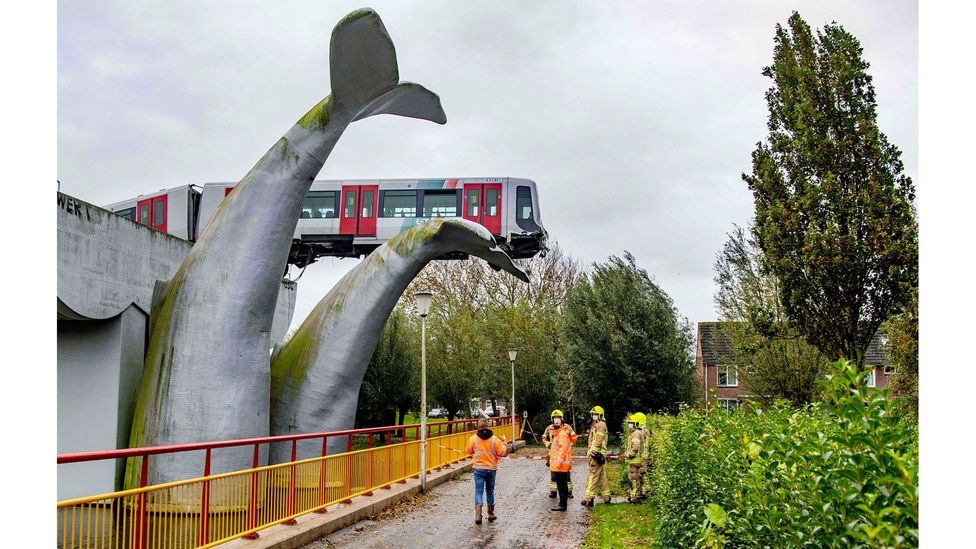 A crashed train rests on a sculpture called Saved by the Whale's Tail in the Netherlands, November 2020 (Credit: Robin Utrecht/ANP/AFP via Getty Images)