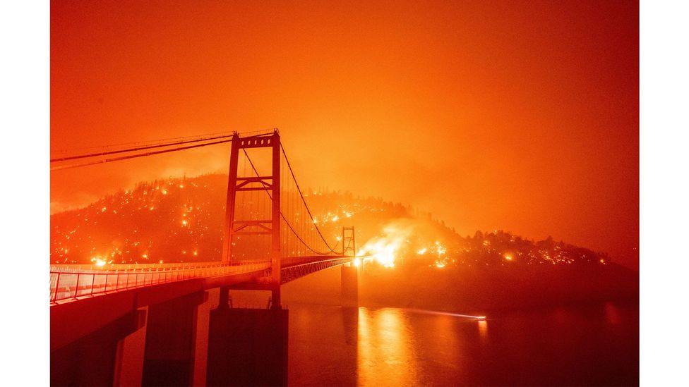 The Bidwell Bar Bridge is surrounded by fire in Lake Oroville, California, September 2020 (Credit: Josh Edelson/AFP via Getty Images)