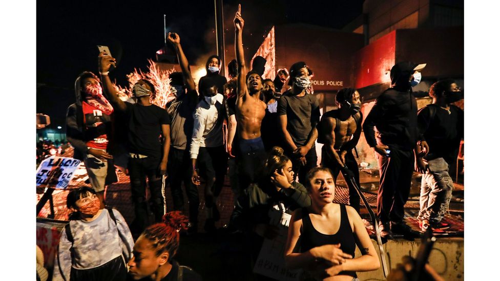 Protesters demonstrate beside a police station in Minneapolis, Minnesota on 28 May, 2020, after the death of George Floyd in police custody (Credit: John Minchillo/AP)