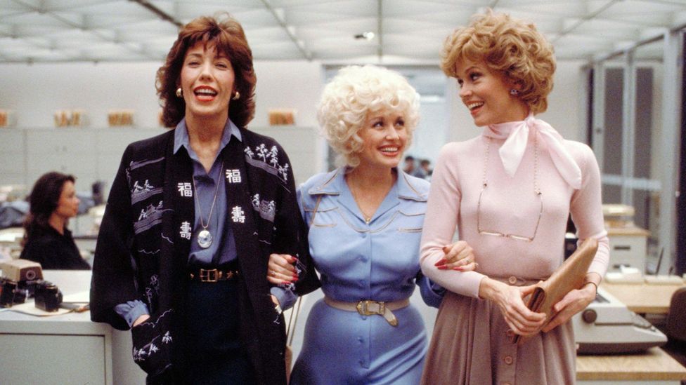 Parton stayed close to her 9 to 5 co-stars Lily Tomlin and Jane Fonda; the film was later made into a musical (Credit: Alamy)