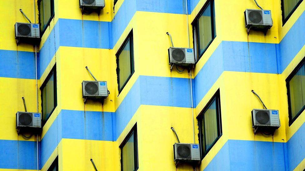 Air-conditioning units on a wall (Credit: Javier Hirschfeld/ Getty Images)