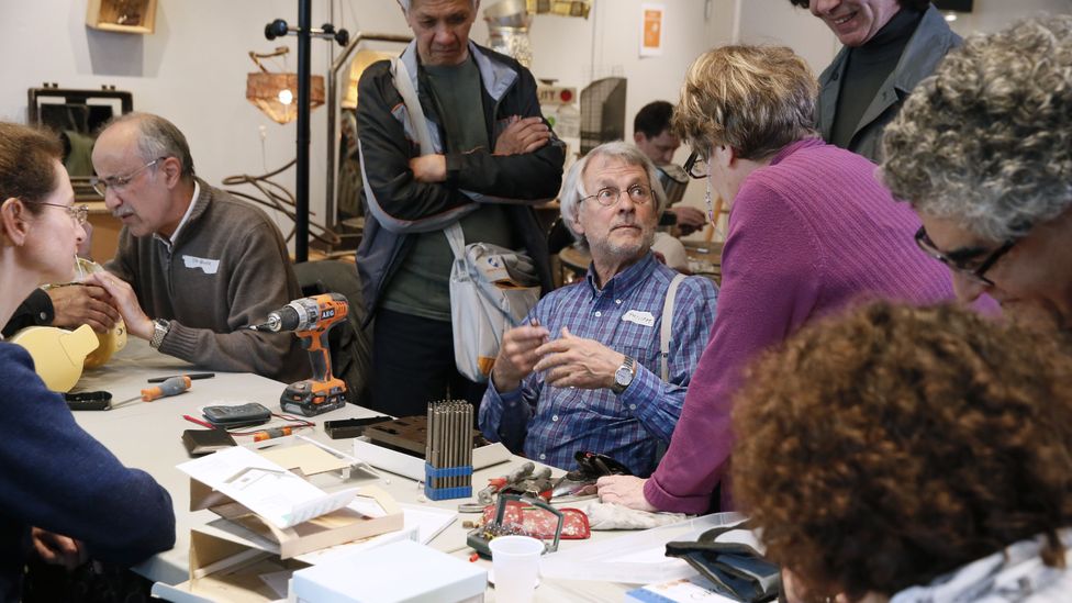 Repair cafes, like this one in Paris in 2014, offer individuals a chance to learn to fix their own broken devices and appliances (Credit: Getty Images)