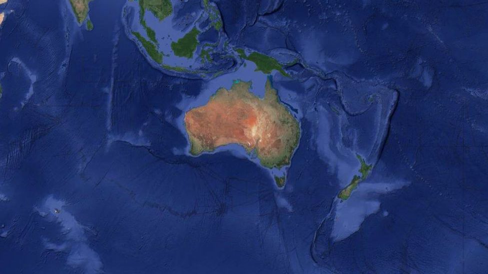 Satellite data can be used to visualise the continent of Zealandia, which appears as a pale blue upside-down triangle to the east of Australia (Credit: GNS Science)