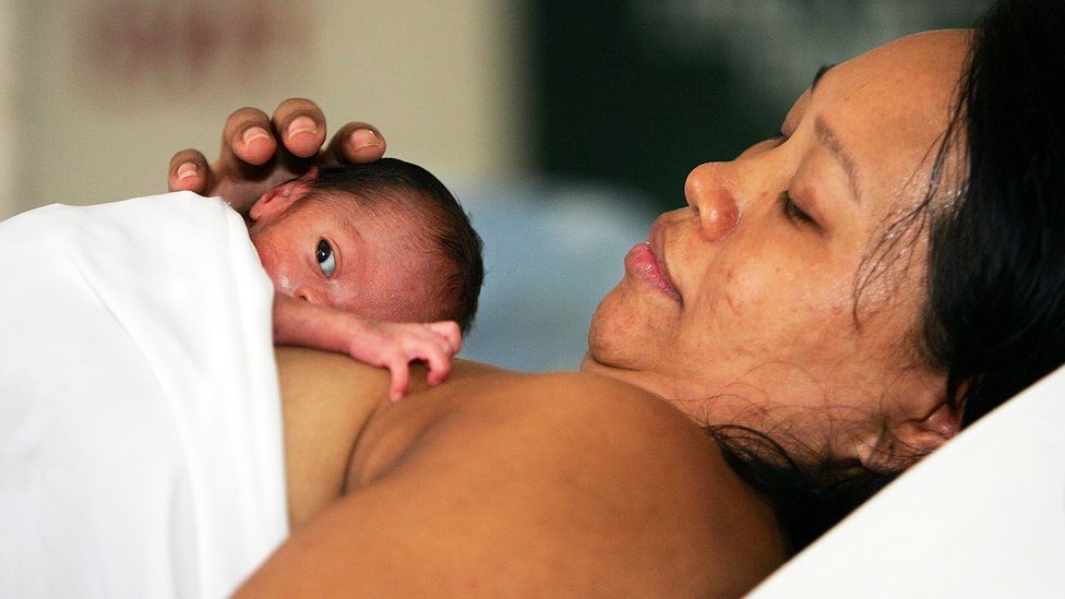 The skin-to-skin contact with their mother can help keep pre-term infants warm but also improves bonding among other benefits (Credit: Paula Bronstein/Getty Images)