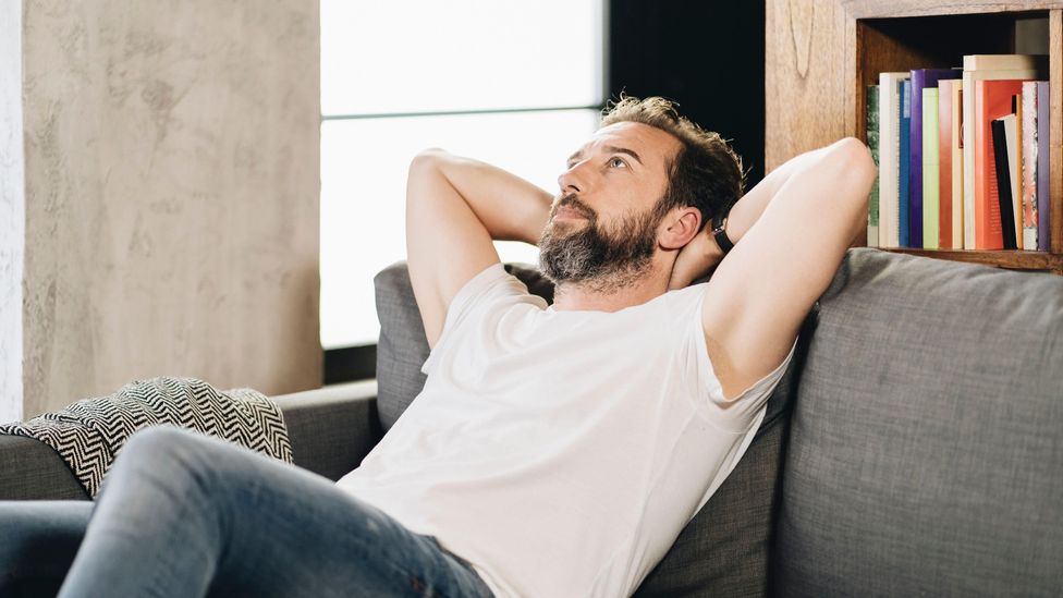 File image of pensive man on a couch
