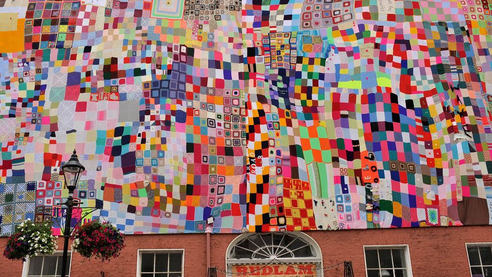 A 15x6m quilt made by hundreds of locals and international families with origins in Londonderry, Northern Ireland, is displayed in the city centre (Credit: George Sweeney/Alamy)