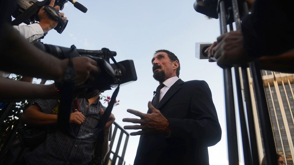 John McAfee speaks to journalists at the Supreme Court in Guatemala, after his location was revealed by a photo (Credit: Johan Ordonez/Getty Images)