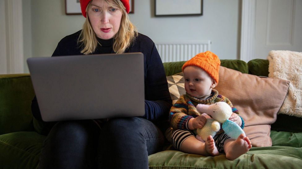 File image of a mum working next to her child