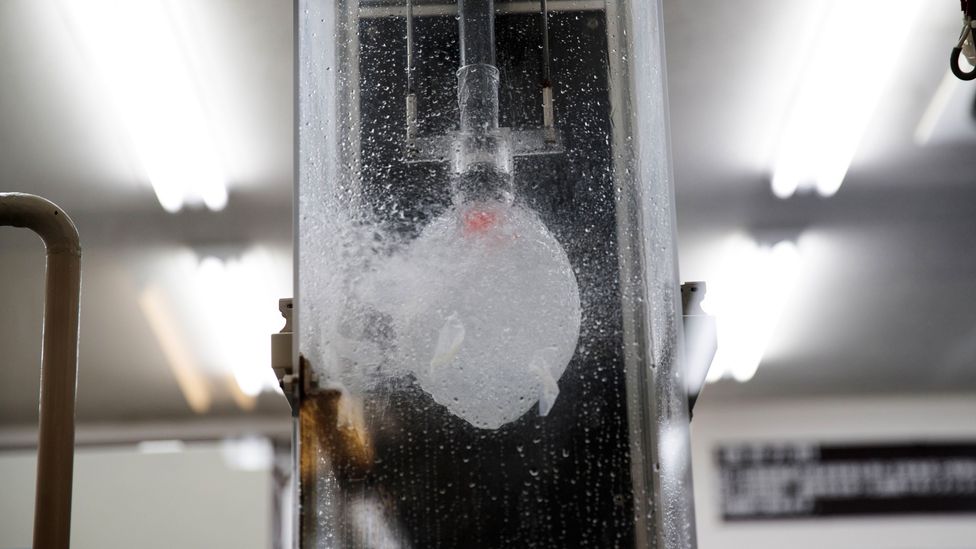 Condoms are often tested for stength by beng inflated or filled with liquid until they burst (Credit: Behrouz Mehri/AFP/Getty Images)